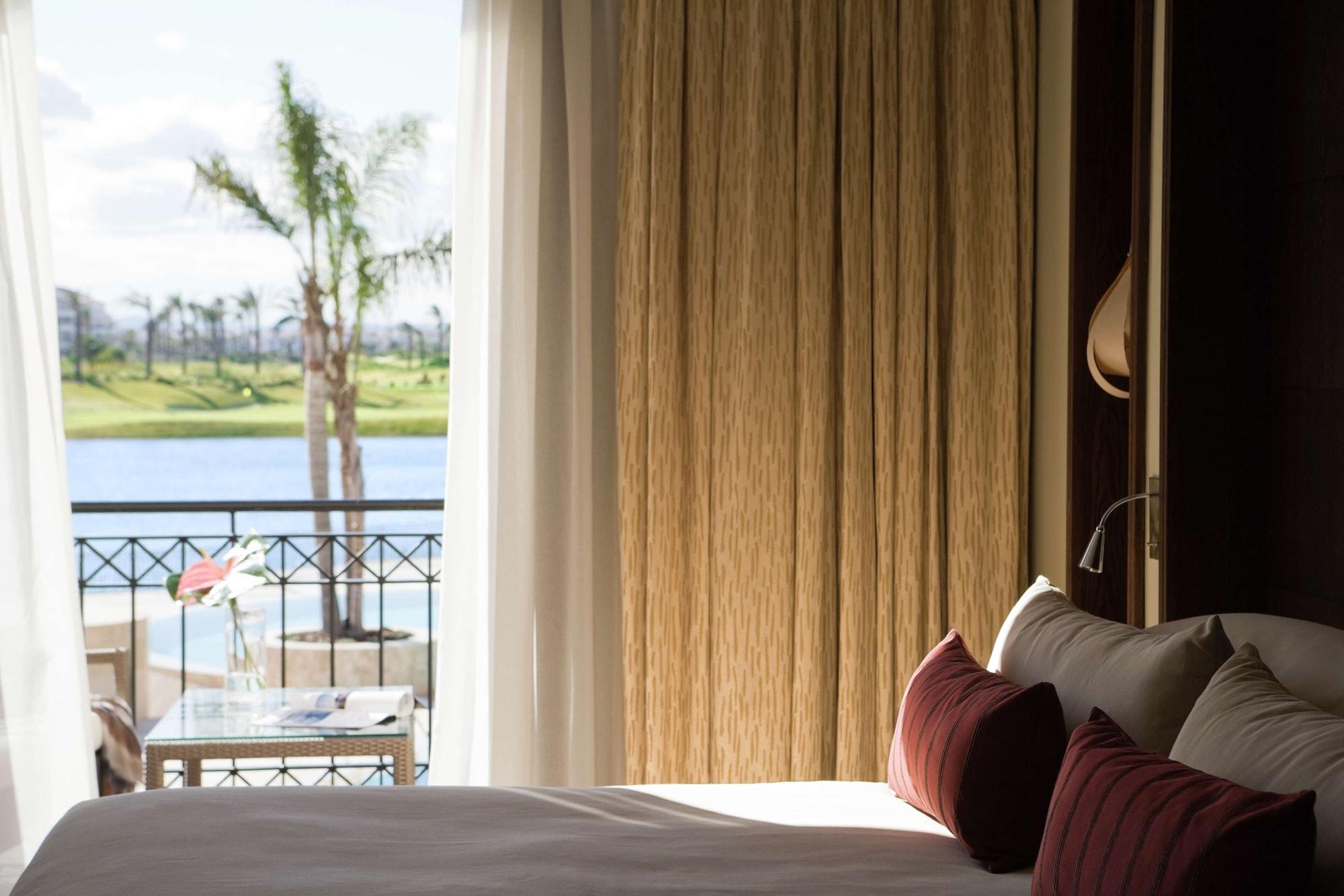 Doubletree By Hilton La Torre Golf Resort Roldan Exterior photo A bedroom at the resort