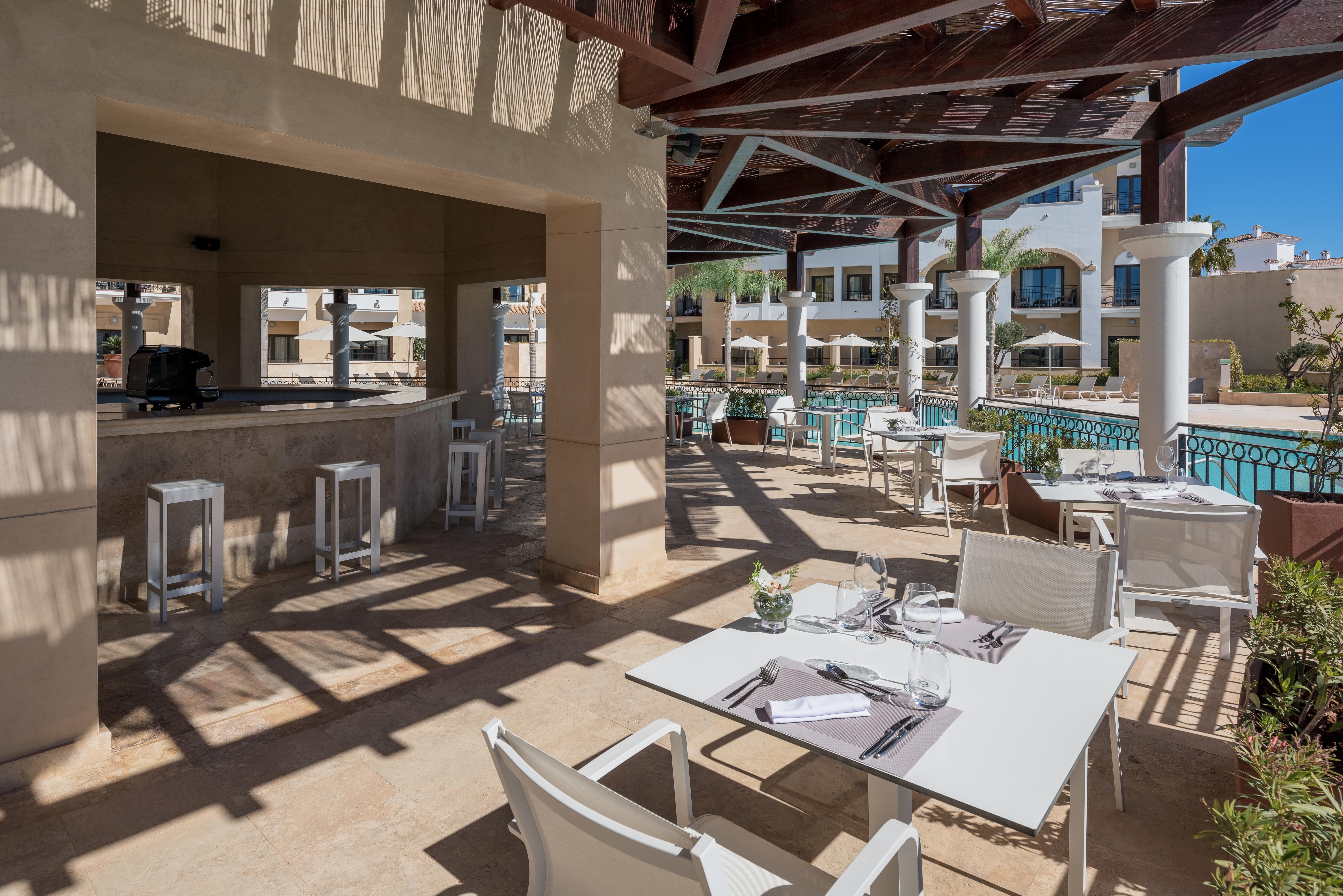 Doubletree By Hilton La Torre Golf Resort Roldan Exterior photo The pool bar at the hotel